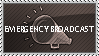 Grey monochrome stamp with a megaphone that reads 'Emergency Broadcast'