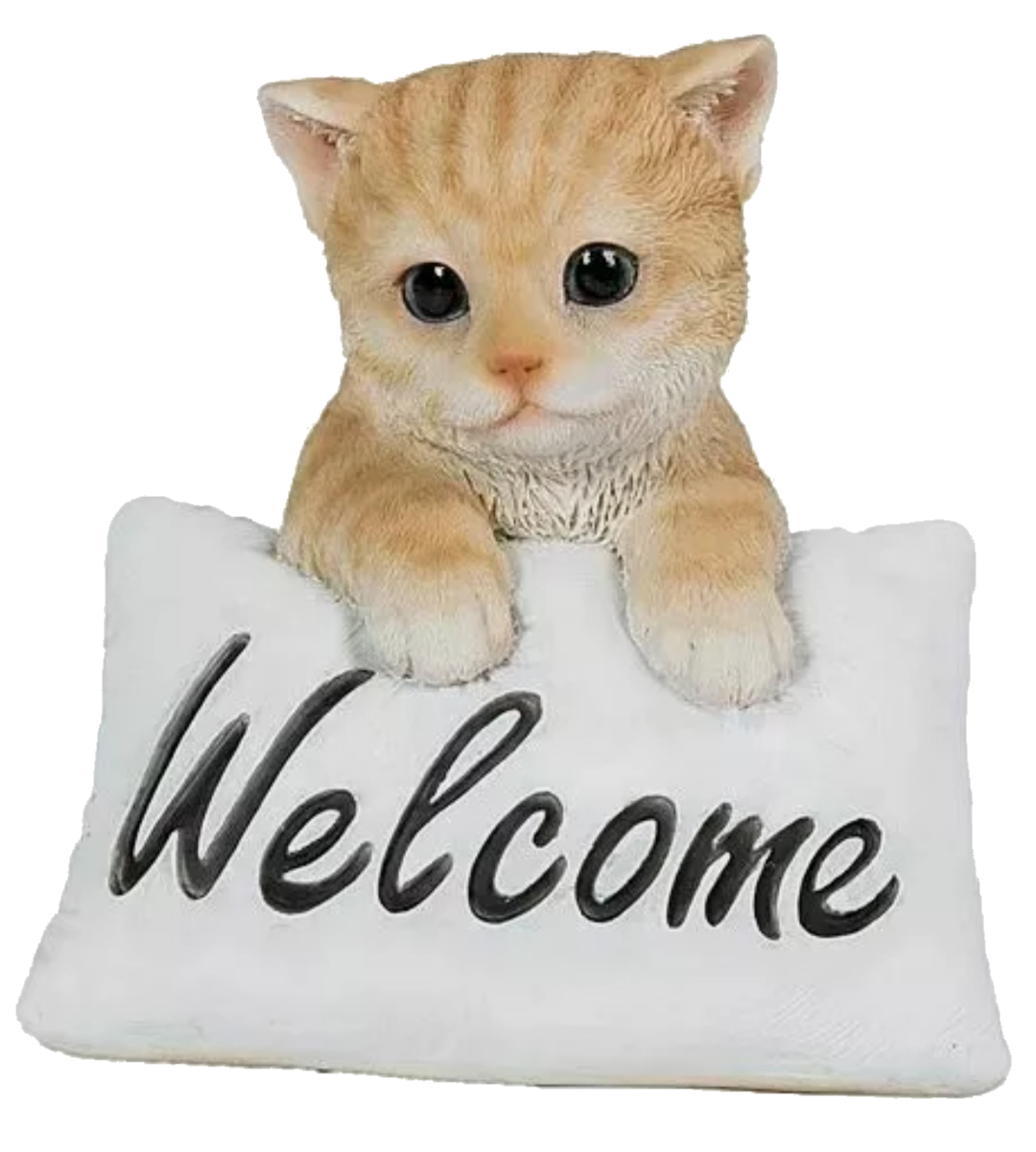 Porcelain ginger cat with a white pillow that reads 'Welcome'
