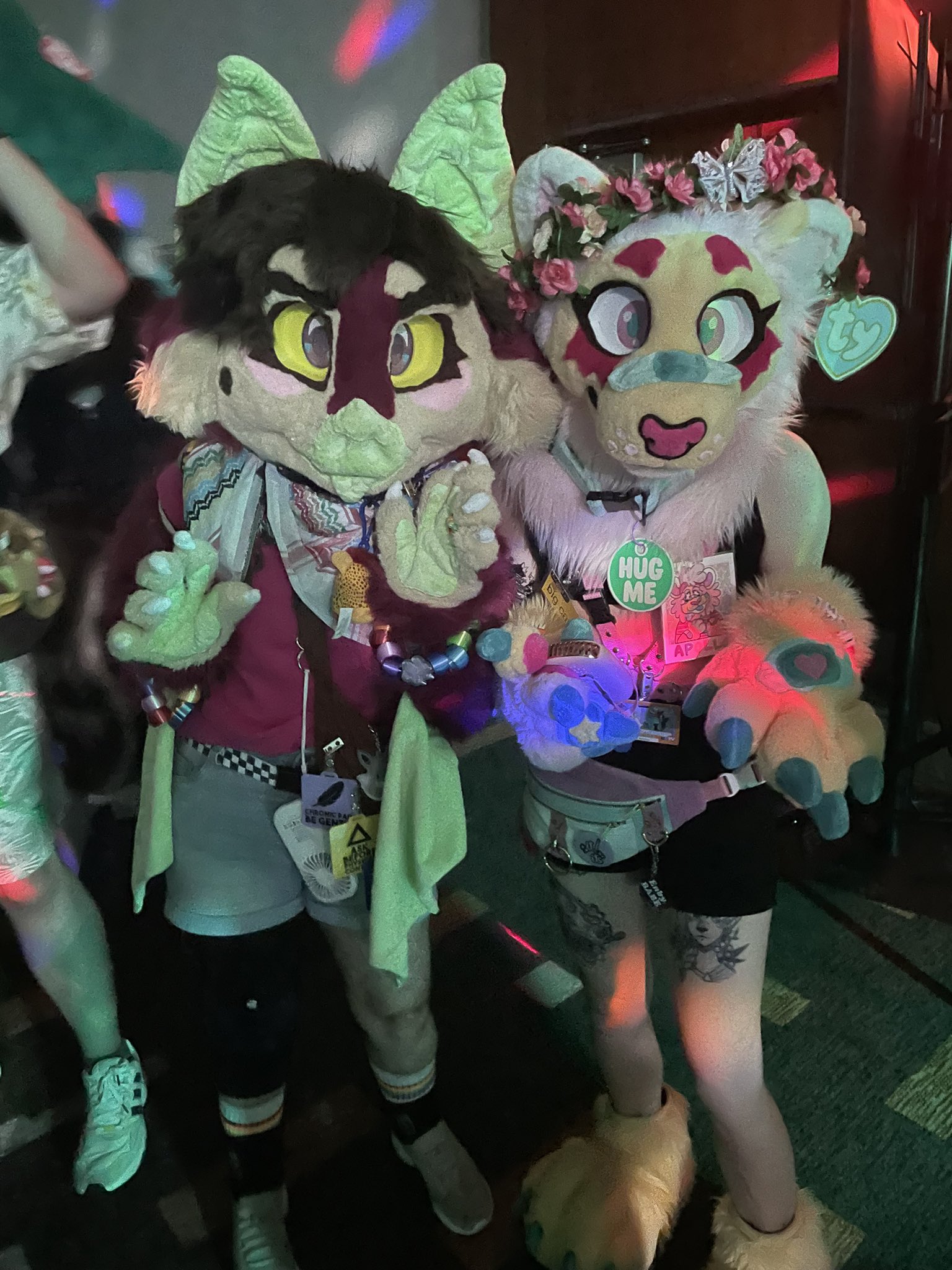 A pair of fursuiters posing for a picture